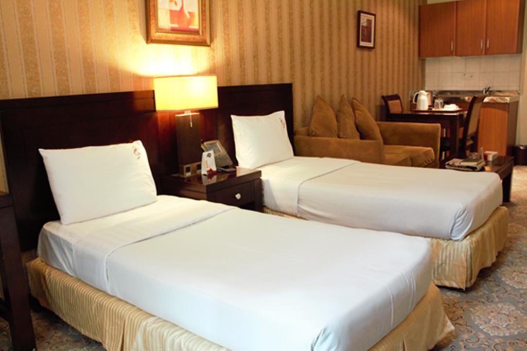 A twin room in Retaj Albayt Suites Hotel, Makkah